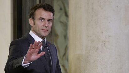 France's President Emmanuel Macron gestures as he waits for Hungarian Prime Minister before a working dinner at the Elysee Presidential Palace in Paris on March 13, 2023.
